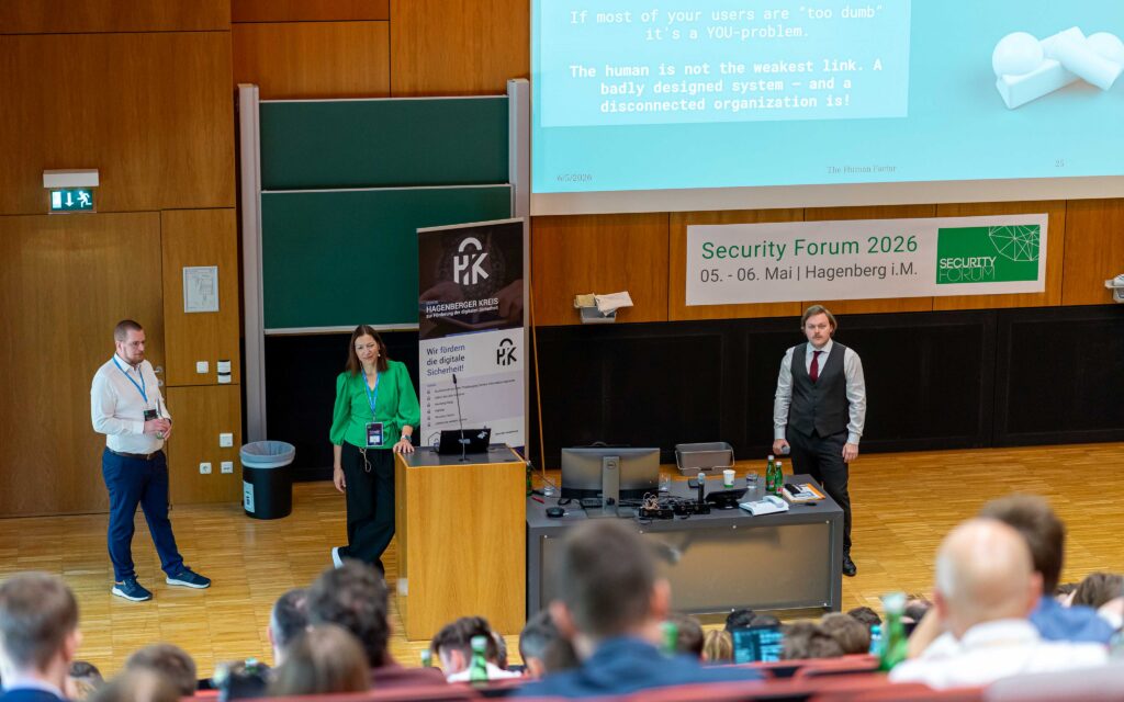 Two speakers during a presentation on the human factor in cybersecurity