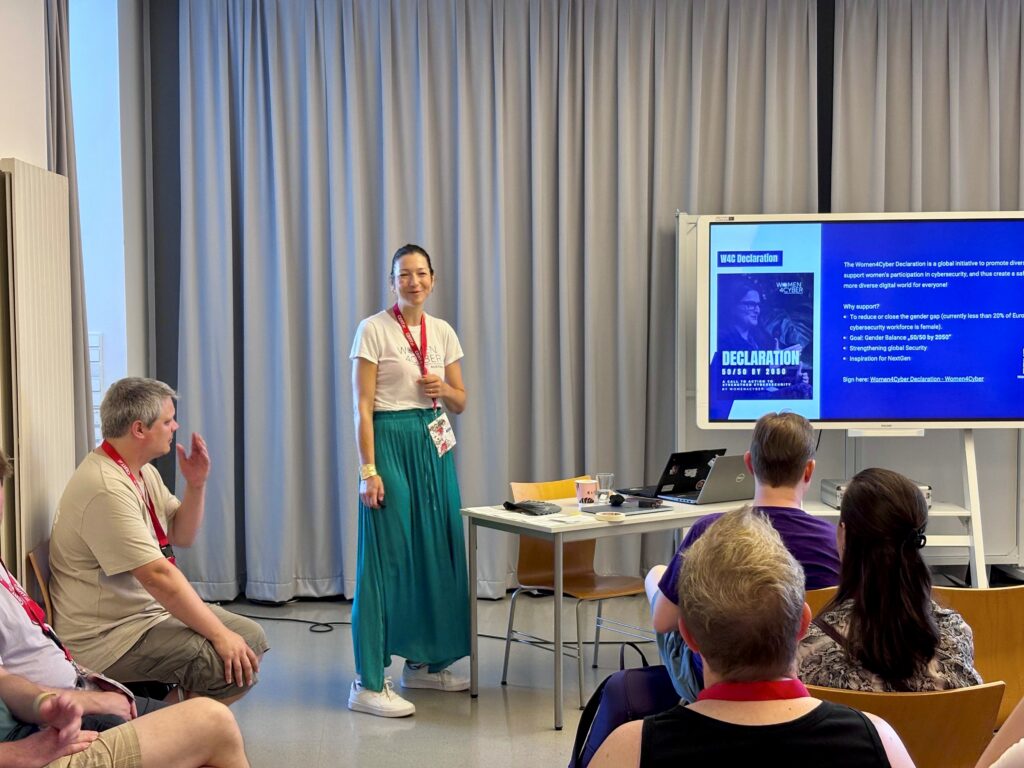 Woman standing in front of people presenting